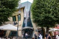 Krzywy Domek (Crooked House) in Sopot, poland with tourists
