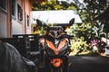 Ktm 390 duke motorcycle parked surrounded by a garden and a building Royalty Free Stock Photo