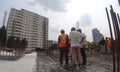 Construction workers discuss among themselves regarding technical issues at the construction site. Royalty Free Stock Photo