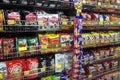 Packed miscellaneous junk foods & snacks on rack for sale