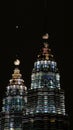 KUALA LUMPUR, MALAYSIA - APRIL 13: Petronas Twin Towers and city at night scene. Royalty Free Stock Photo