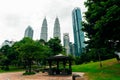 Kuala Lumpur, Malaysia - April, 2019 Petronas Twin towers panorama, Kuala Lumpur central park