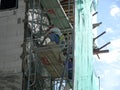 Brick wall plastered by construction workers using the cement plaster.