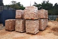 Stock pile of clay brick on wooden pallets stacked at the construction site. Royalty Free Stock Photo