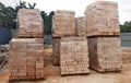 Stock pile of clay brick on wooden pallets stacked at the construction site. Royalty Free Stock Photo