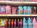 Fabric softeners packed in the plastic bottle and soft pack displayed for sale on the rack. Royalty Free Stock Photo