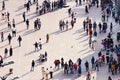 City square with daily life in big town - people crowd who spend their free time, interact with each other.