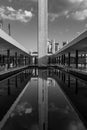 Grayscale shot of the obelisk reflecting in a mosque