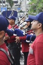 Brass band players playing a musical instrument while Royalty Free Stock Photo