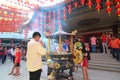 Man praying during Chinese New Year celebration