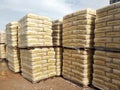 Stock pile of portland cement in commercial bags. Royalty Free Stock Photo