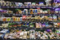 Various brands of butter, cheese, and margarine on the shelf in a grocery store