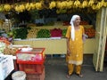 A woman in a greengrocer at the Chow Kit Market in Kuala Lumpur