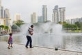 KUALA LUMPUR,MALAYSIA - JANUARY 10, 2017: The fountains of The Petronas Towers, the famous skyscrapers in Kuala Lumpur, Malaysi Royalty Free Stock Photo