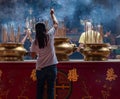 Woman Praying In A Chinese Temple In Kuala Lumpur, Malaysia