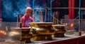 Man Praying In A Chinese Temple In Kuala Lumpur, Malaysia