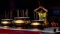 Man Praying In A Chinese Temple In Kuala Lumpur, Malaysia