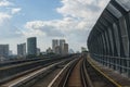 Public train track with view of skyscrappers. Transportation concept. outdoor. Royalty Free Stock Photo