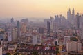 Top view of misty Kuala Lumpur city skyline with Petronas twin towers shot in the morning at sunrise Royalty Free Stock Photo