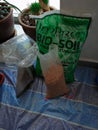 Kuala Lumpur, Malaysia - Jul 29, 2019: Bio soil in packages, apartment balcony gardening concept