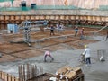 Concreting work by construction workers at the construction site.