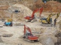 Heavy construction machines doing building foundation works at the construction site. Royalty Free Stock Photo