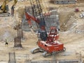 Heavy construction machines doing building foundation works at the construction site. Royalty Free Stock Photo