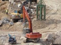 Heavy construction machines doing building foundation works at the construction site. Royalty Free Stock Photo