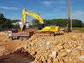 Heavy machinery doing earthwork at the construction site.