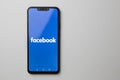 Kuala Lumpur, Malaysia - July 23, 2019: Smartphone showing Facebook logo on white background