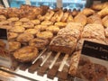 Various types of breads are displayed for sale inside the bakery display rack. Royalty Free Stock Photo