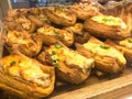 Various types of breads are displayed for sale inside the bakery display rack. Royalty Free Stock Photo