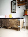 Big cargo wooden crate upcycled into a sofa to match the industrial interior design in an Royalty Free Stock Photo