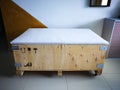 Big cargo wooden crate upcycled into a sofa to match the industrial interior design in an
