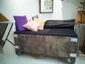 Big cargo wooden crate upcycled into a sofa to match the industrial interior design in an Royalty Free Stock Photo