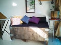 Big cargo wooden crate upcycled into a sofa to match the industrial interior design in an