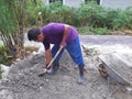 Kuala Lumpur, Malaysia - 01 june 2020 : Man during earthmoving process. General worker.