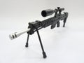 A plastic model of military sniper automatic gun in small-scale isolated on white background.