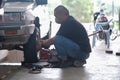 Tyre change on the car in a workshop by a mechanic Royalty Free Stock Photo