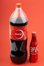 Coca Cola drink over a red  background Royalty Free Stock Photo
