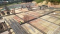 Floor slab and beam reinforcement bar under fabrication at the construction site by workers.