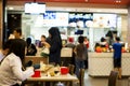 KUALA LUMPUR , MALAYSIA Ã¢â¬â MARCH 16, 2020. People using rubber gloves when eating in fast food restaurant. Washing hands has just