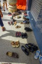 Kuala Lumpur, Malaysia - March 9, 2017: Shoes spread outside a Hindu temple, they have to be removed as a sign of Royalty Free Stock Photo