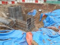 Underground drainage manhole under construction by construction workers at the construction site. Royalty Free Stock Photo