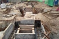 Underground drainage manhole under construction by construction workers at the construction site. Royalty Free Stock Photo