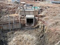 Underground drainage manhole under construction by construction workers at the construction site. Royalty Free Stock Photo