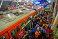 Kuala Lumpur, Malaysia - March 9, 2017: Very busy train station in the city, with crowds of commuters waiting for their Royalty Free Stock Photo