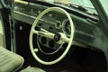 Classic car driver steering and interior dashboard.