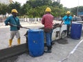 Construction workers creating concrete road curb at the construction site.