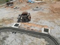 Construction workers creating concrete road curb at the construction site.